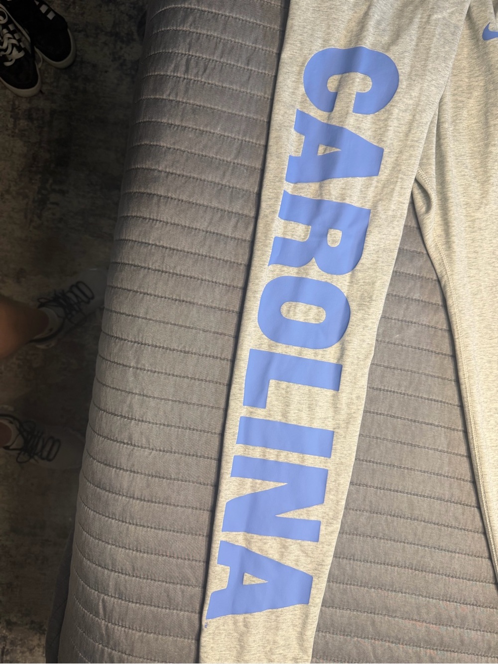 Women’s Grey Cotton Carolina Joggers with UNC Blue Lettering down R leg. Size M